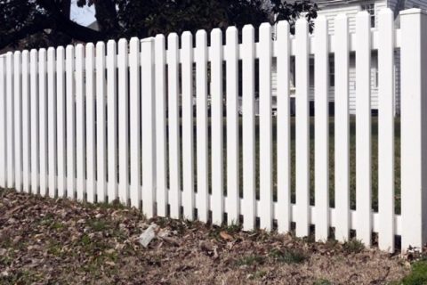 Professional fencing contractors installing PVC fencing